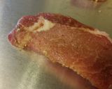 A picture of step 2 of Brown sugar bacon wrapped pork chops.