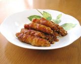 A picture of step 5 of Sweet and Salty Carrot and Pepper Filled Teriyaki Pork Rolls.
