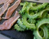 A picture of step 1 of Goya & Crispy Pork Tossed with Chilli Mayo.