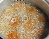 A picture of step 4 of Orange Bread balls.