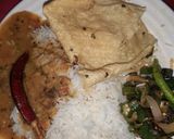 A picture of step 3 of Dal fry fried bhindi papad and plain rice.