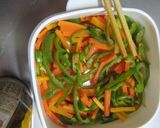 A picture of step 4 of Bell Pepper & Carrots with Sesame-Miso Dressing.