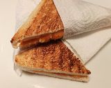 A picture of step 3 of Cheddar and brown sauce toastie.