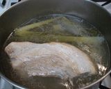 A picture of step 3 of Pork Belly Simmered with Daikon Radish.
