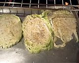 A picture of step 5 of Roasted cabbage steaks w/rubbed garlic.