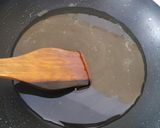 A picture of step 6 of Znoud-el-sit with creamy choco hummus filling and red grape sauce.