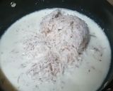 A picture of step 1 of Milk and raw coconut ladoo.