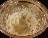 A picture of step 11 of Vanilla Layer Cake with Whipped White Chocolate Filling and Fros.