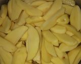 A picture of step 1 of Deep fried potato wedges.