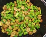 A picture of step 1 of Karonde mirchi ka achaar/cranberry chilli pickle.