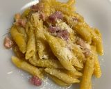 A picture of step 7 of Pennette with Pancetta, Yellow Cherry Tomato Sauce, and Pecorino (Fake Carbonara).