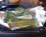 A picture of step 5 of BBQ Chicken Quinoa on a bed of pak choy.