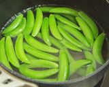 A picture of step 3 of Speedy and Easy Sugar Snap Peas and Grated Cheese.