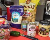 A picture of step 1 of 4 Cheese loaded nachos.