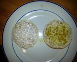 A picture of step 4 of Taisen's english muffin w/tomato, cucumber, cheese and dressing.