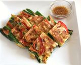 A picture of step 16 of Pajeon (Korean Style Piccata) with Scallion and Sakura Shrimp.