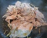 A picture of step 4 of Pork Bits and Pea Shoots Stir-Fried with Ginger and Pepper.