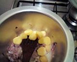 A picture of step 3 of Minji stew served with white rice.