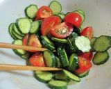 A picture of step 4 of Easy Tomato and Cucumber Salad with Sesame Ponzu Dressing.