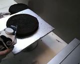 A picture of step 3 of 8 inch tall chocolate brownie cake.