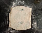 A picture of step 6 of Gozleme / Turkish stuffed flat bread.