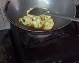 A picture of step 12 of Aloo fulcopi katla rosha ar misti doi.
