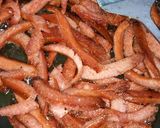 A picture of step 3 of Shallow fried sausage strips.