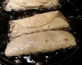 A picture of step 4 of Flautas with green salsa.