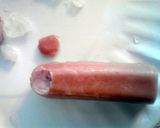 A picture of step 3 of Bloody Severed Fingers ( hot dogs with ketchup ) halloween.