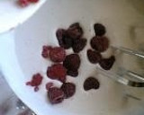 A picture of step 7 of Chocolate Roll Cake with Pink Raspberry Cream.
