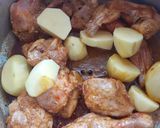 A picture of step 4 of Dhagi alu chicken.