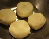 A picture of step 6 of Double Cheese Rice Flour and Potato Fritters in a Frying Pan.