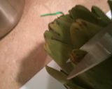 A picture of step 1 of Steamed artichokes.