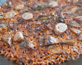 Foto del paso 10 de la receta: Arroz seco de butifarra de setas y alcachofas