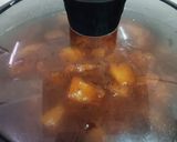 A picture of step 4 of Sweet and Spicy Raw Mango Curry with Jaggery.