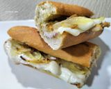 Foto del paso 5 de la receta: Bocadillo de lomo con queso, cebolla y ajoaceite