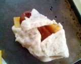 A picture of step 6 of Lil' Cheesy Dogs.