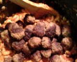 A picture of step 7 of macaroni meatballs and meat and cheese sauce.