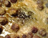 A picture of step 15 of macaroni meatballs and meat and cheese sauce.