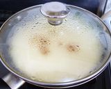 A picture of step 8 of Pancake Mix Cinnamon Apple Cake in a Frying Pan.