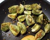 A picture of step 5 of Garlic Sautéed Baby Artichokes.