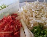 A picture of step 3 of Shangrila soup with bread sticks.