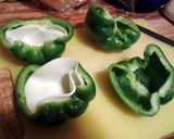 A picture of step 4 of Philly cheesesteak stuffed bell peppers.