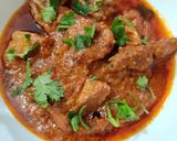 A picture of step 11 of Onion Tomato Chicken.