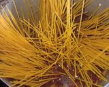 A picture of step 2 of Jollof spaghetti with beef and potato salad.