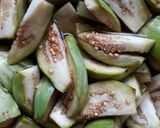 A picture of step 1 of Vankaaya Sanagala curry (brinjal black chana curry).