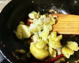 A picture of step 4 of Aloo bathe aloo choka and aloo pithika.
