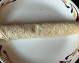 A picture of step 2 of Pin wheel spinach and cheese wraps.