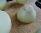 A picture of step 1 of Marmite Roasted Onions.