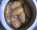 A picture of step 1 of Panch foran potato curry.